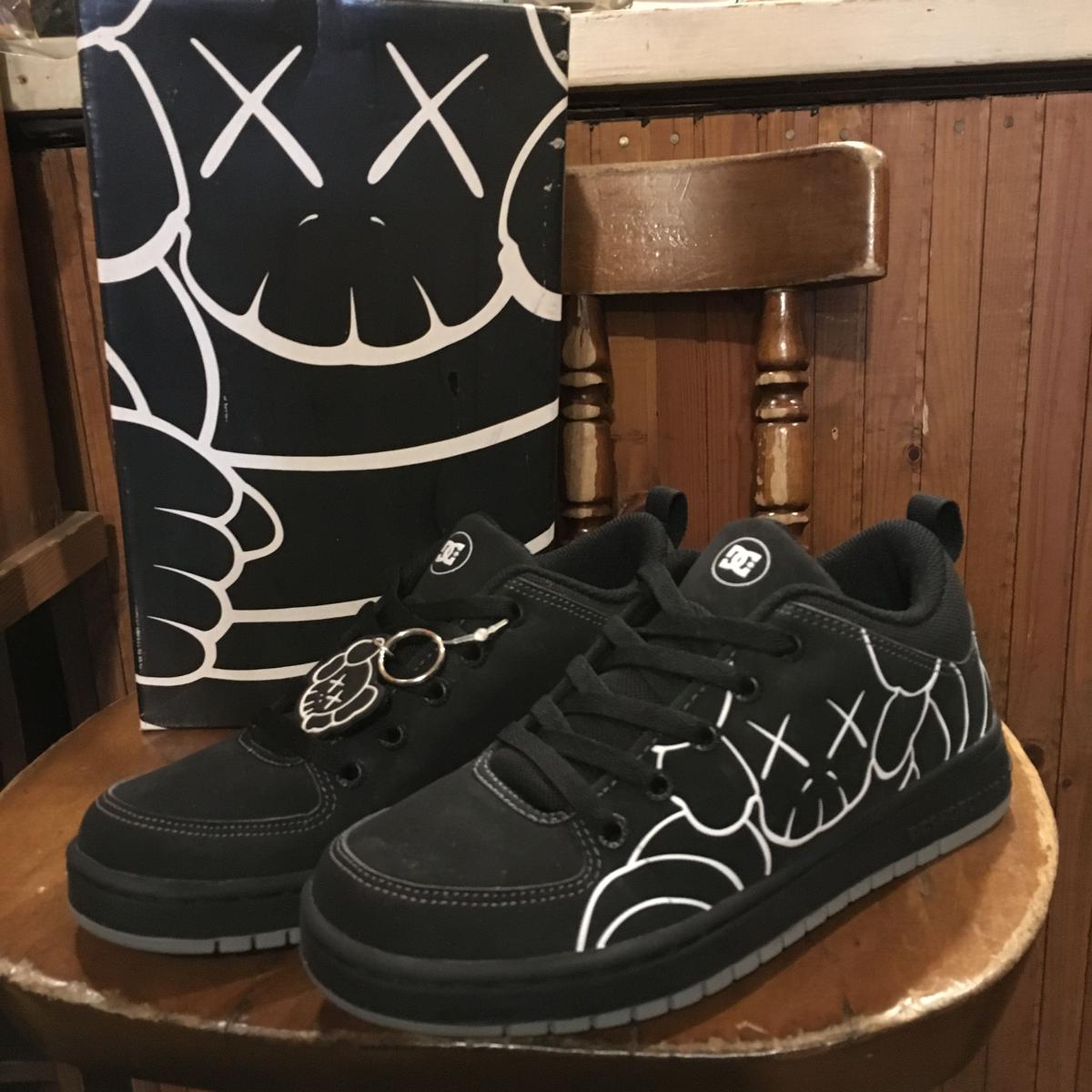 kaws dc shoes