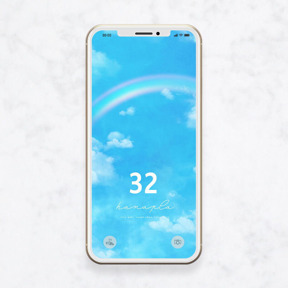 幸運数字32と虹のエネルギー 青空と白い雲に架かるレインボーがドラマチックなスマホ壁紙
