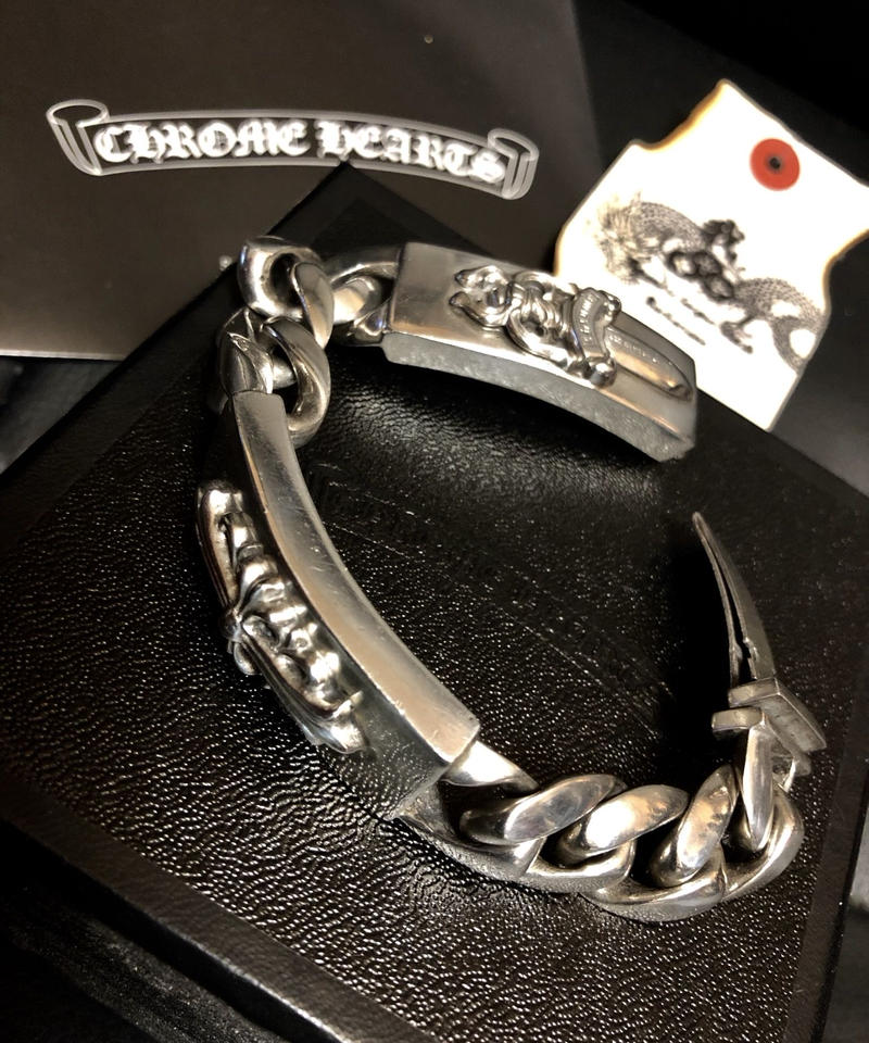 DiamondJewelryNY Double Loop Bangle Bracelet with a St John Neumann Charm.